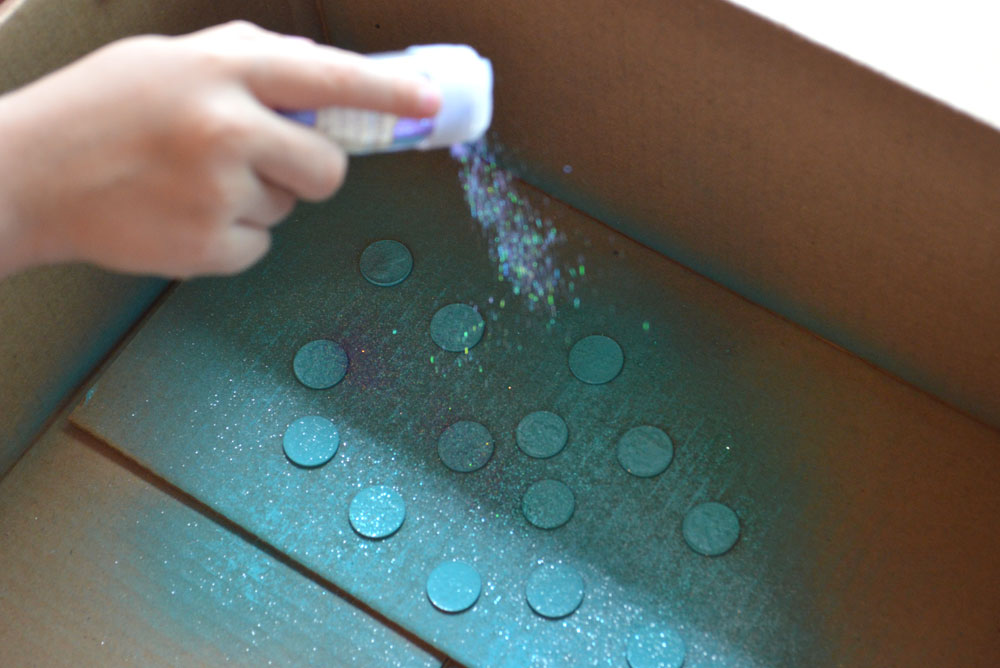 spray old coins with glitter