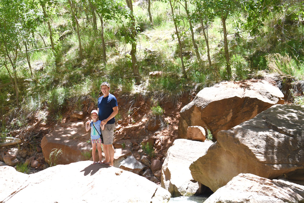 Scrambling over rocks and playing in the river at Zion Canyon