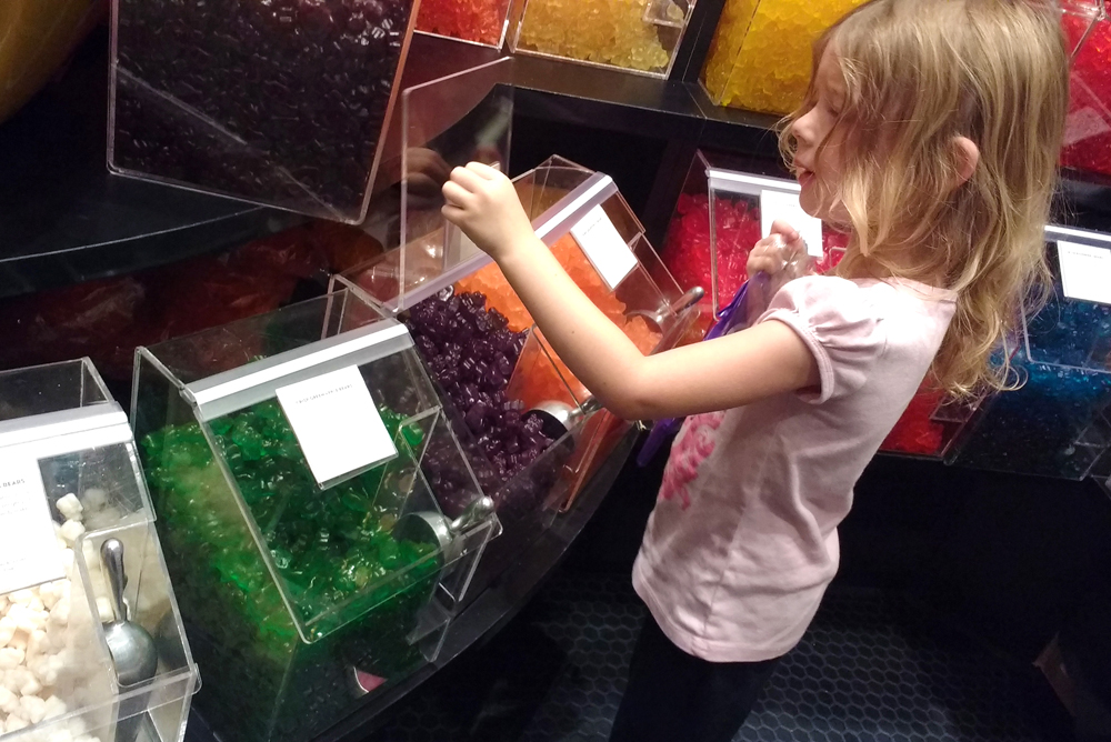 Choosing candy at Lolli and Pops candy store Alderwood Mall in Seattle