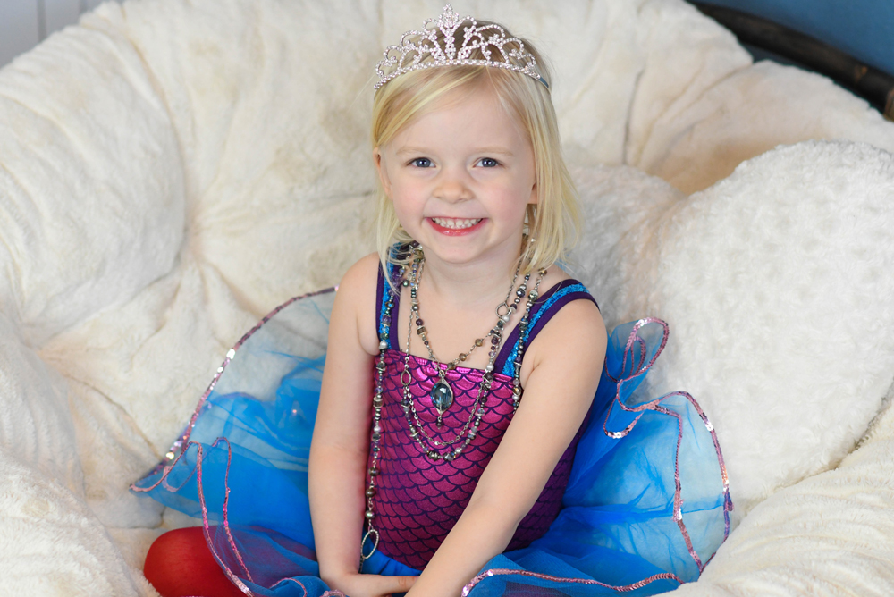Little girl ballerina with layered necklaces