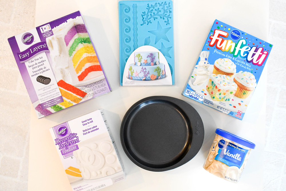 Materials needed for a baby shark birthday cake