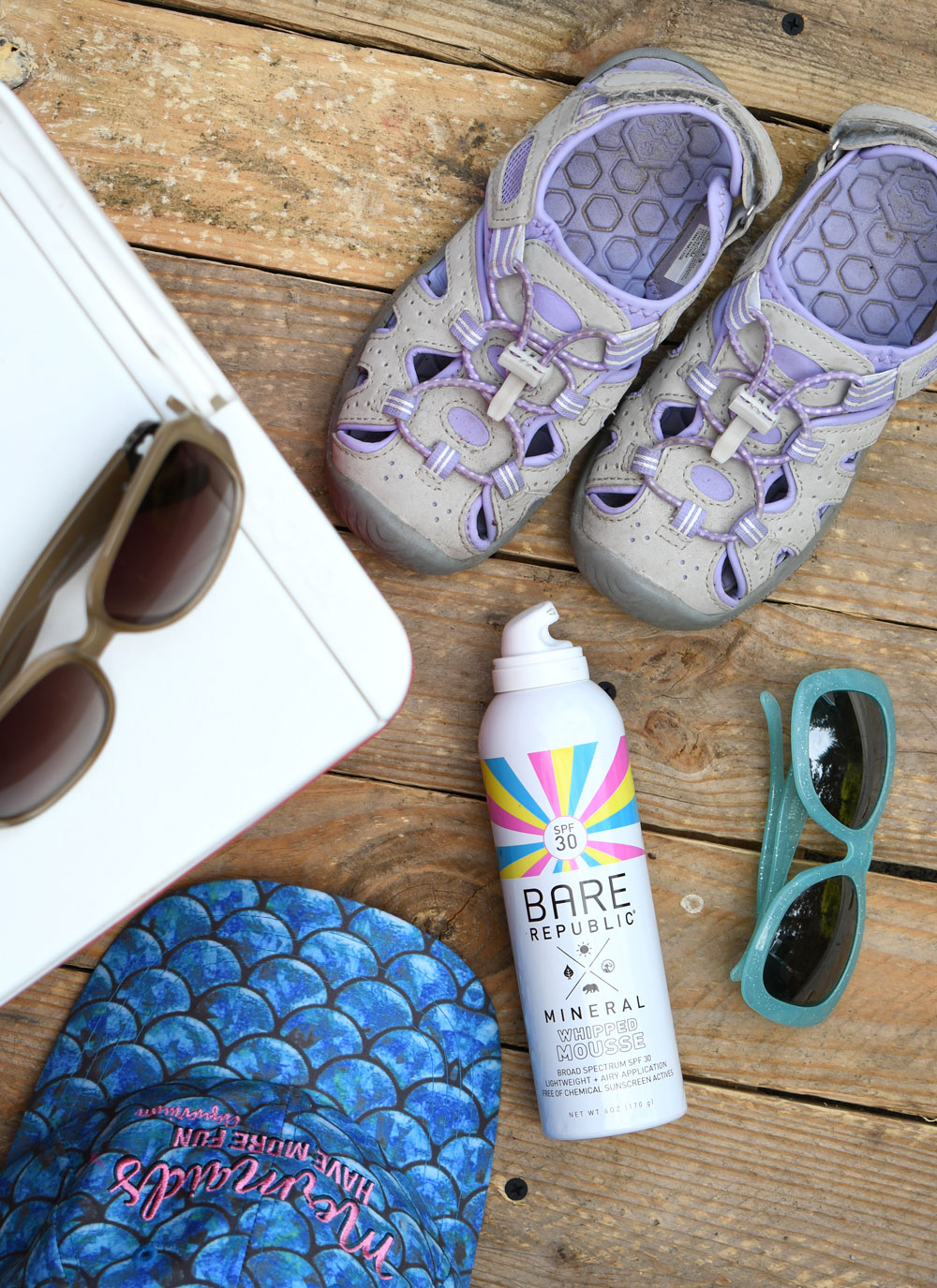 Hiking essentials sunglasses, sunscreen and hats