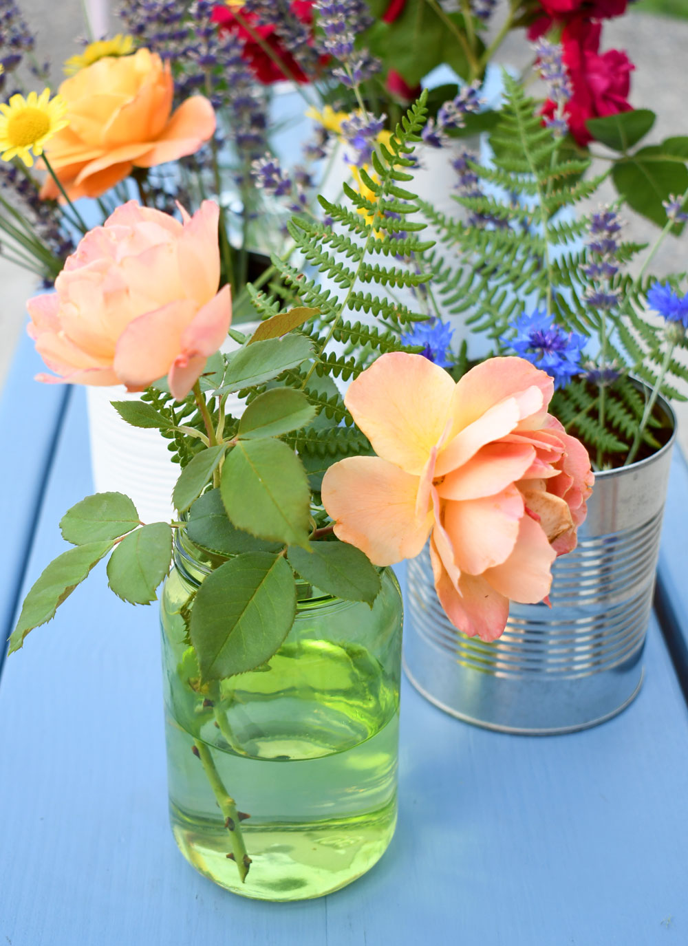 Whimsical flower vases using recycled cans and jars