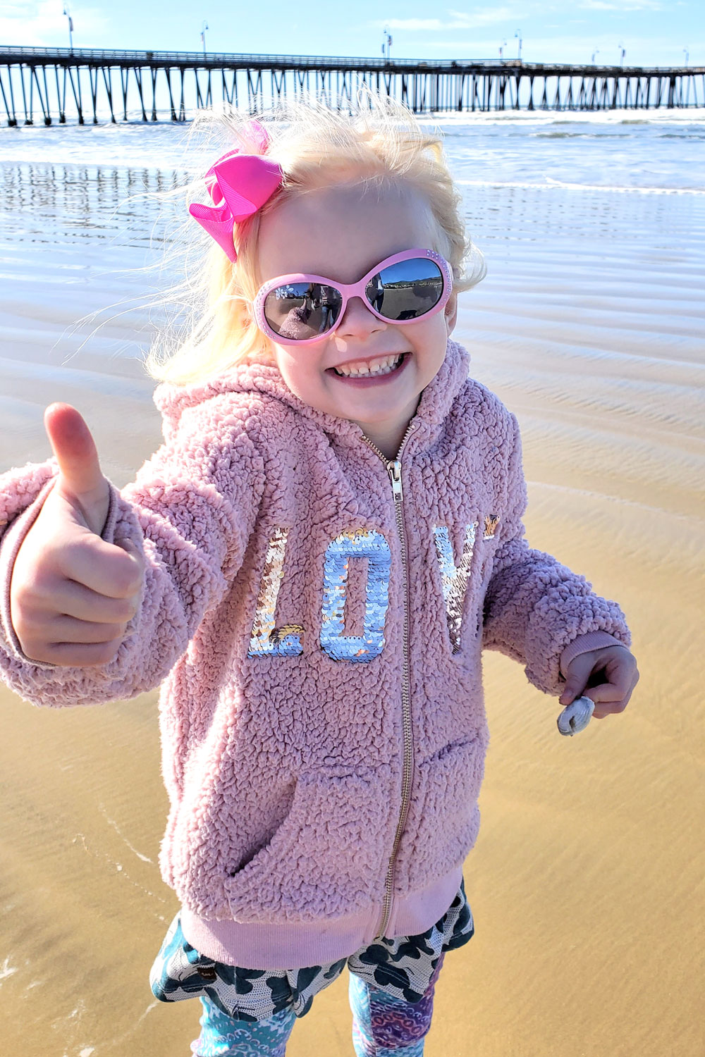 Girl wearing sunglasses Pismo Beach California