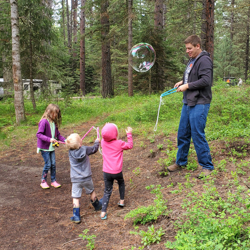 Playing with bubbles fun kids activity family camping trip