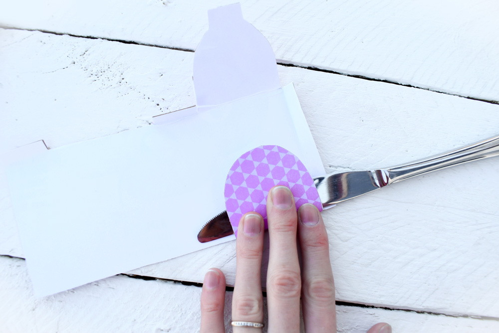 Use the straight edge of a butter knife to create clean creases on the doll mailbox