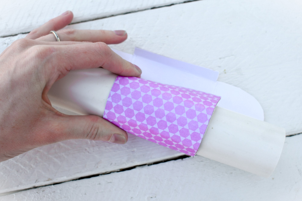 Roll the top of the doll mailbox over a curved object to create the curved top
