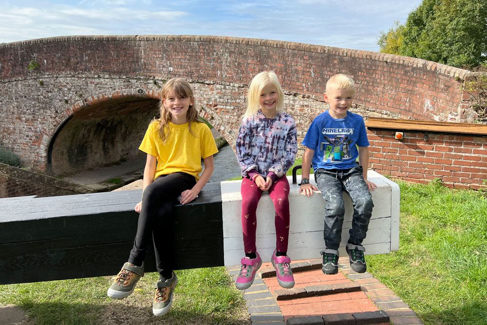 Kids helping a narrowboat canal lock