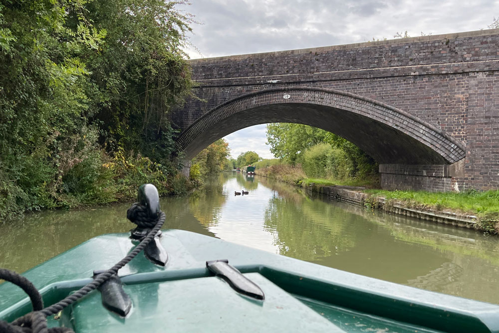 Narrowboat and stone bridge in England