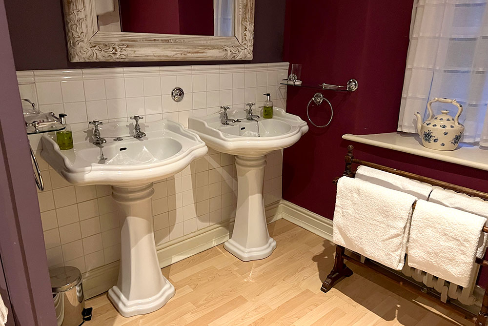 victorian bathroom with two sinks at Augill