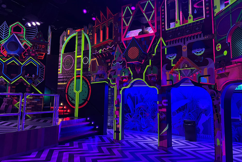 neon alien world meow wolf real unreal